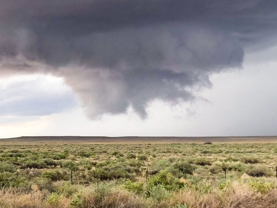 A storm cloud forming over desert plains