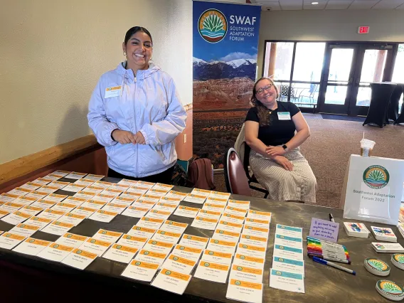 Maria Mata Robles and Amanda Leinberger (CCASS) working at the nametag booth together