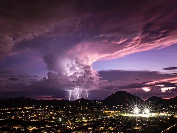 A lighting strike over Tucson at dusk.