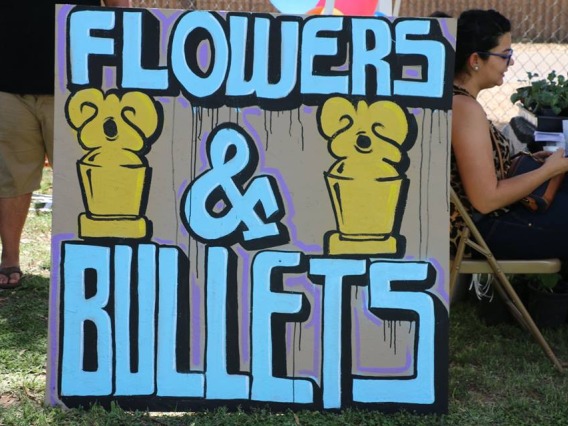 Flowers and Bullets sign