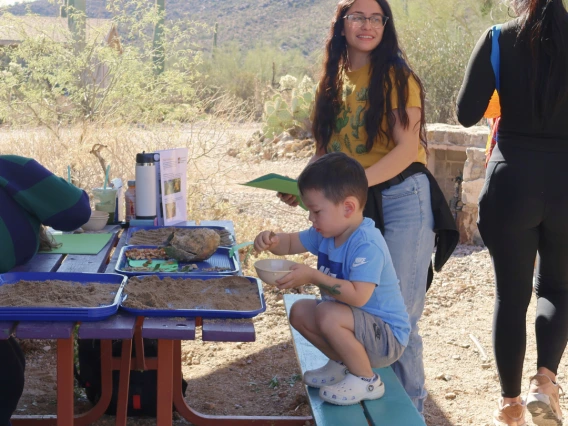 Child and woman participating in Cooper Center activity