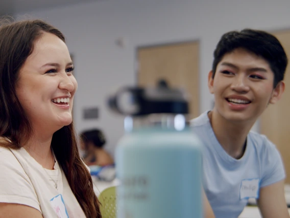 Students laughing while working together in class.