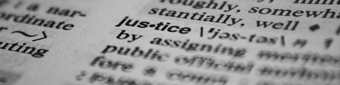 dictionary entry for "justice." the definition and surrounding words are blurred.