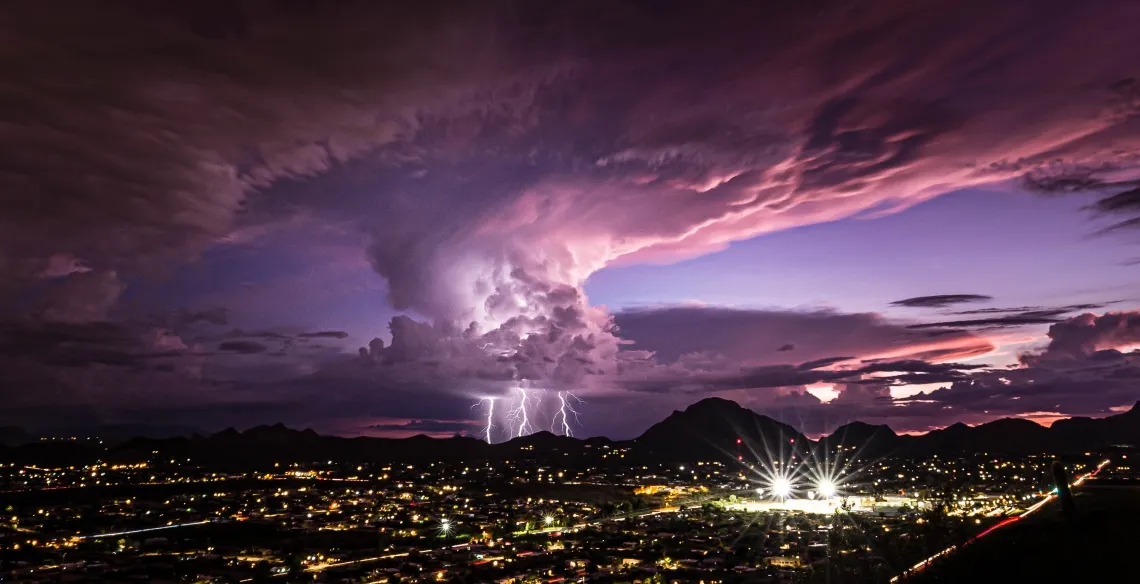 A lighting strike over Tucson at dusk.