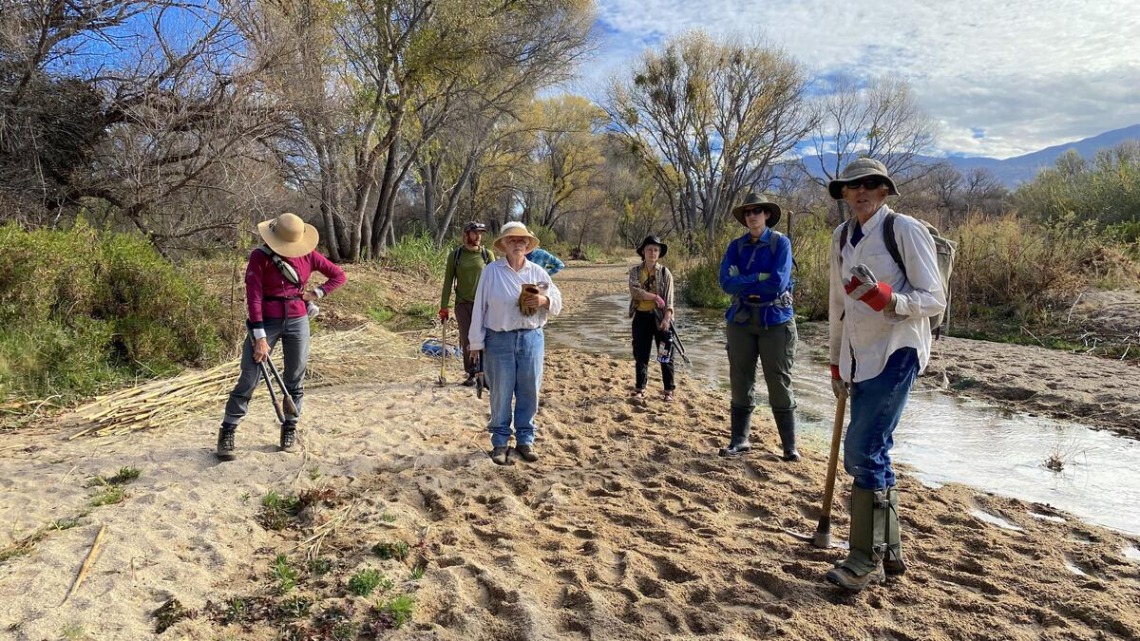 Group of volunteers cleaning up the Tanque Verde Creek