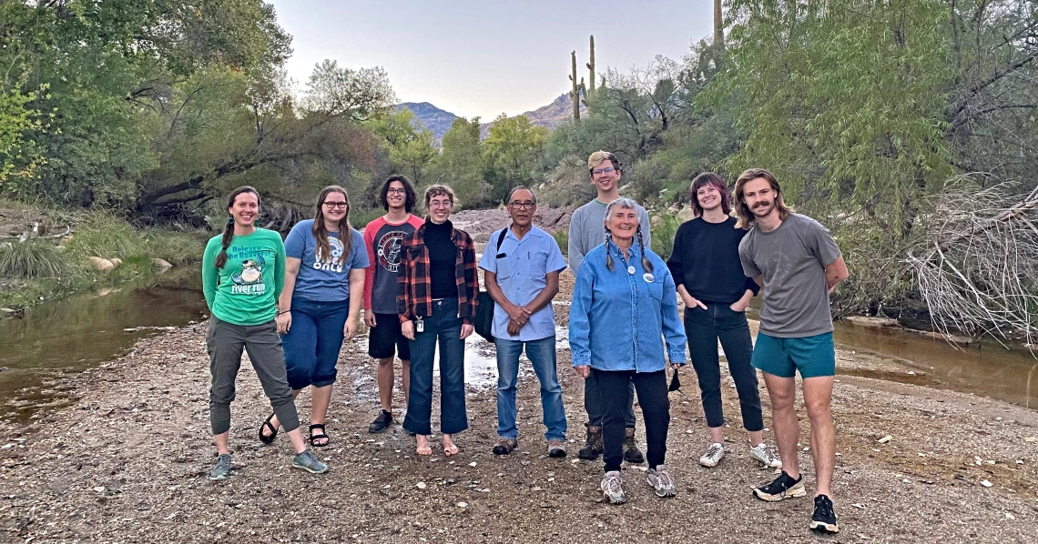 A group of students outdoors, smiling.