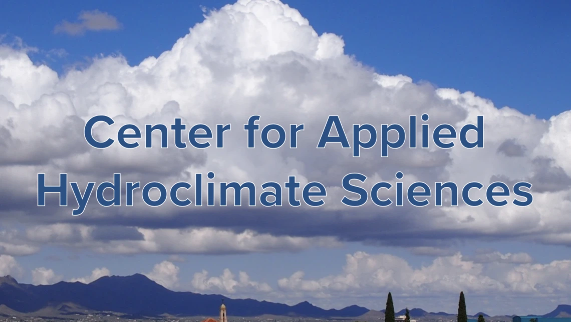 The Center for Applied Hydroclimate Sciences title on a backdrop of clouds over a town.