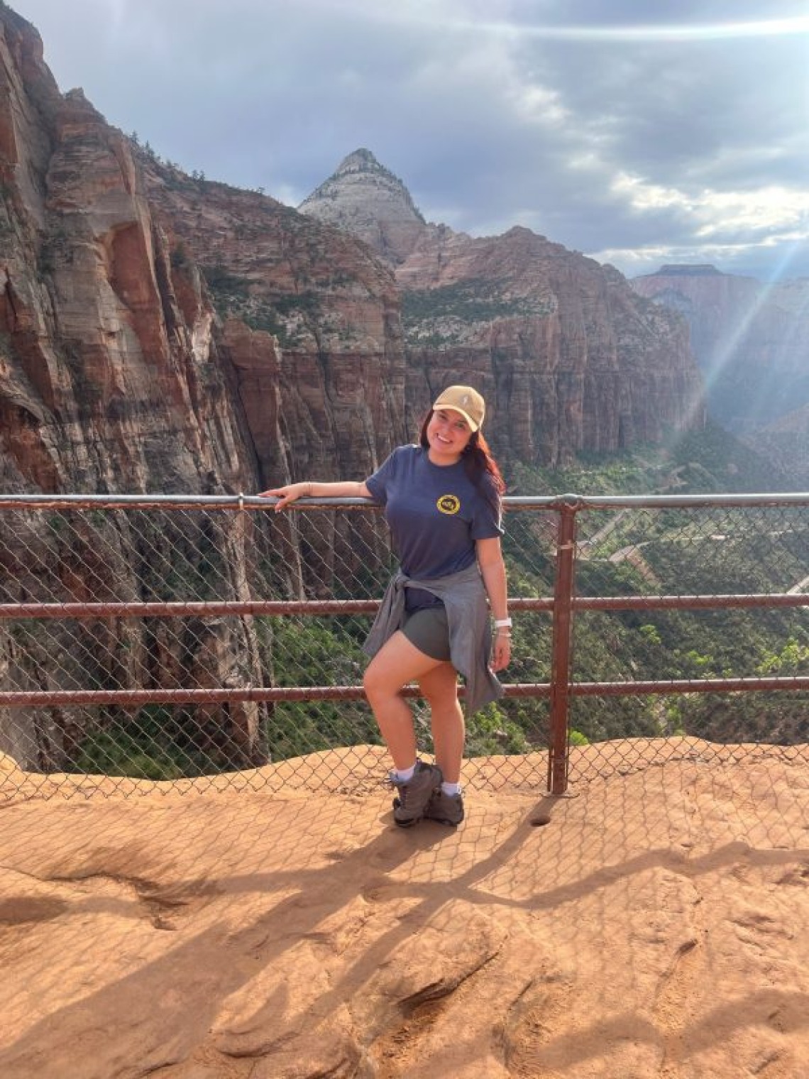 Gabriella Parra posing for a picture in front of the canyon at Zion national park.