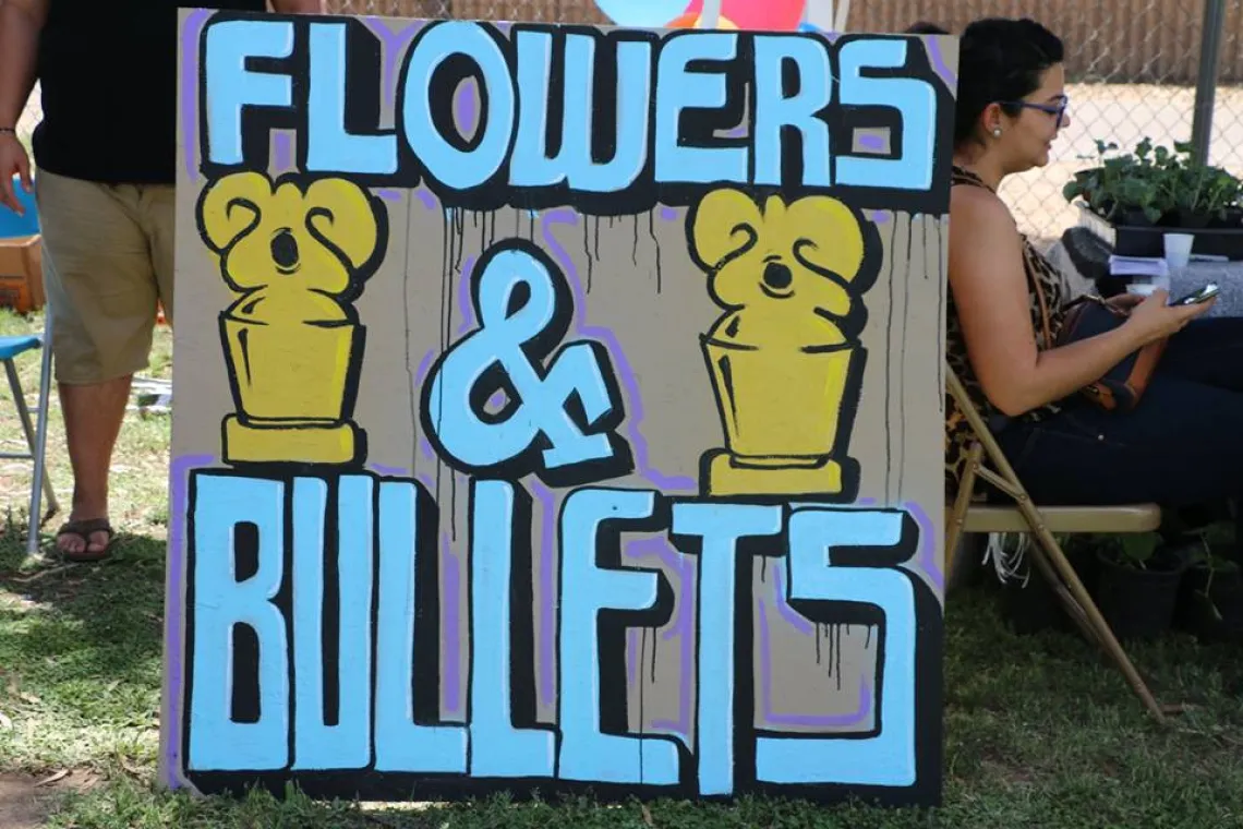 Flowers and Bullets sign