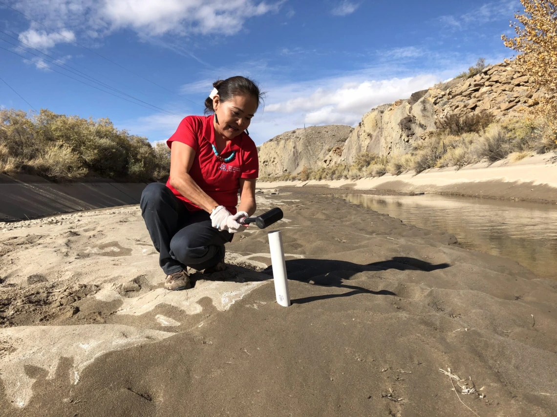 Woman doing research on riverbed