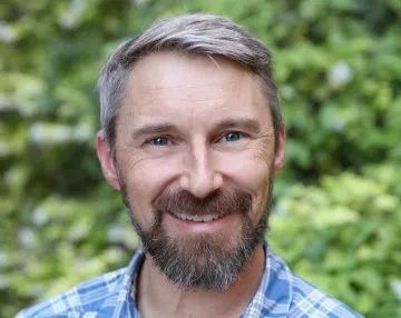 A headshot of Mike Crimmins.