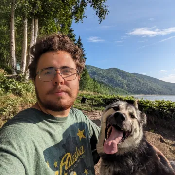 Student with dog with mountain background