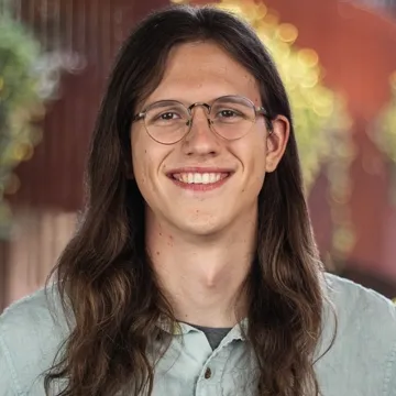 Smiling student with long hair 