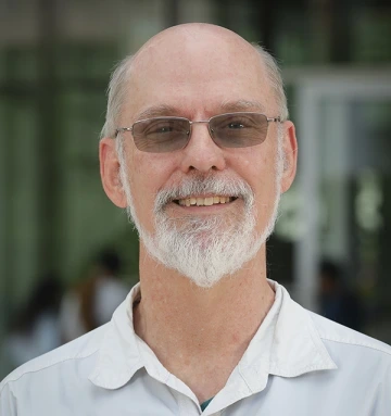 A headshot of George Frisvold.