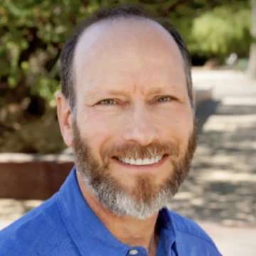 A headshot of Gregg Garfin.