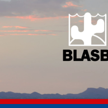An evening sky over the silhouette of mountains with the BLASB logo in the upper corner.